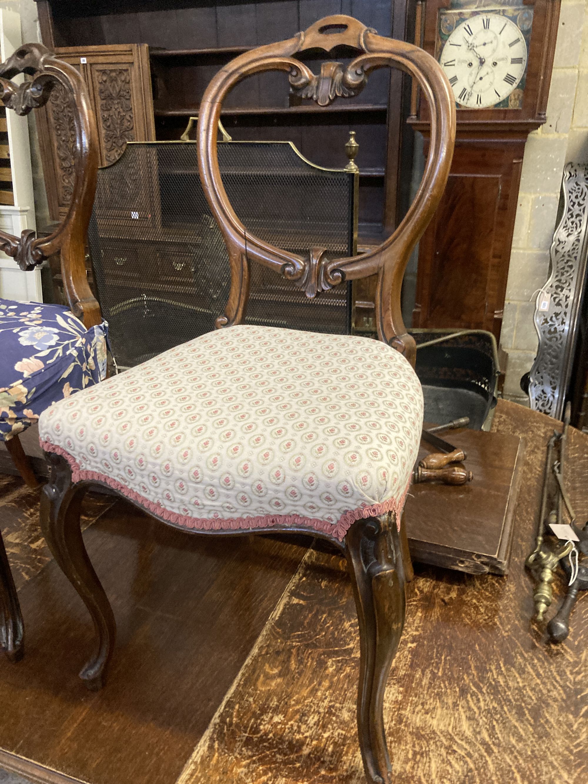 A set of six Victorian balloon back rosewood dining chairs